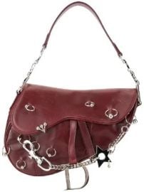 Saddle piercing hand bag at Farfetch